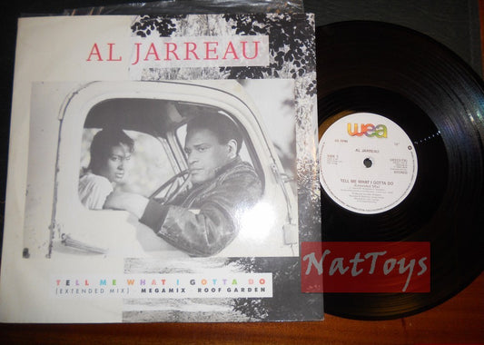 12" 33 RPM Al Jarreau TELL ME WHAT I GOTTA DO (UK 1986, WEA U8523TX) - NM/NM