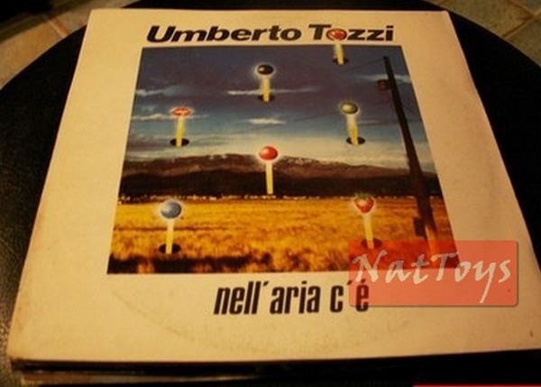 7" 45 RPM Umberto Tozzi IN THE AIR THERE IS/LIKE A MUSIC BOX (Italy 1983) - NM/NM